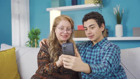 Mother-and-son-video-chatting-on-smart-mobile-phone.